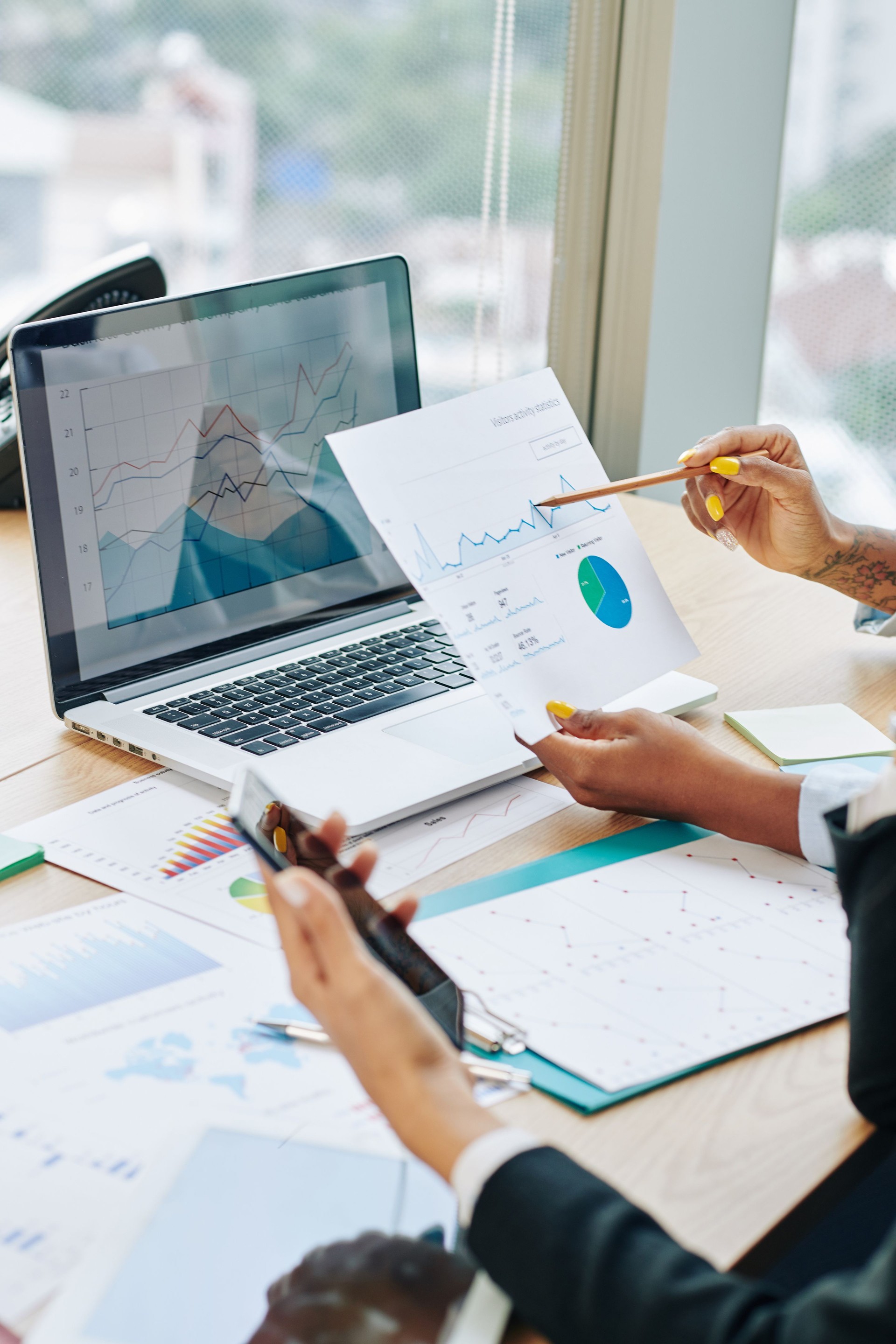 Business executives discussing financial data