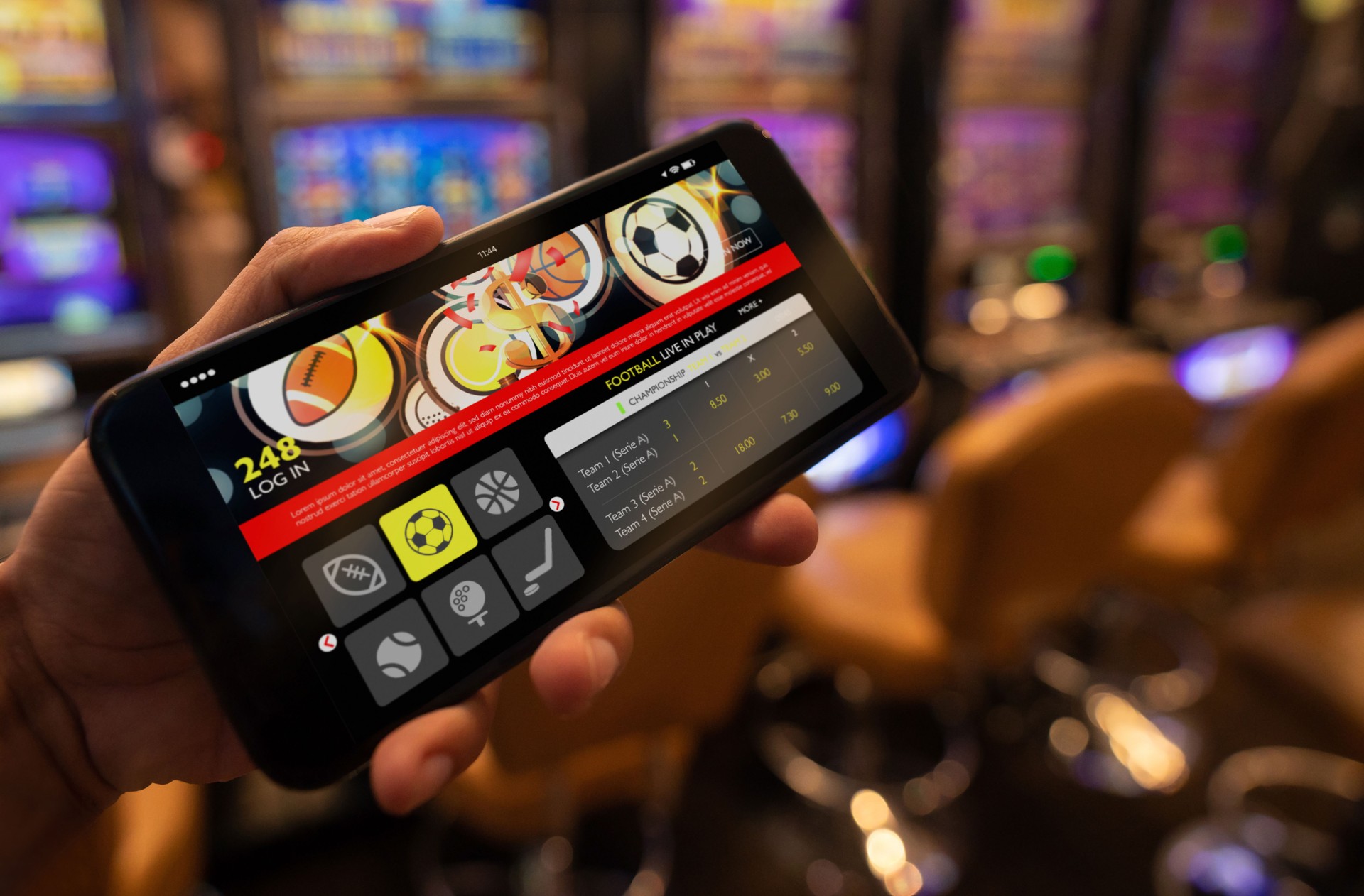 Close up of unrecognizable person holding a smartphone with a live football bet application